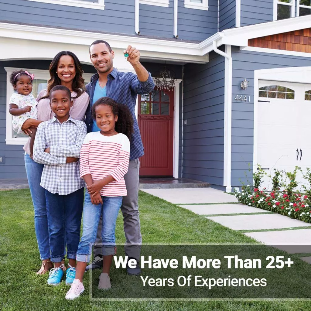 A Hurricane Home Improvement family with more than 25 years of experience standing in front of a house.